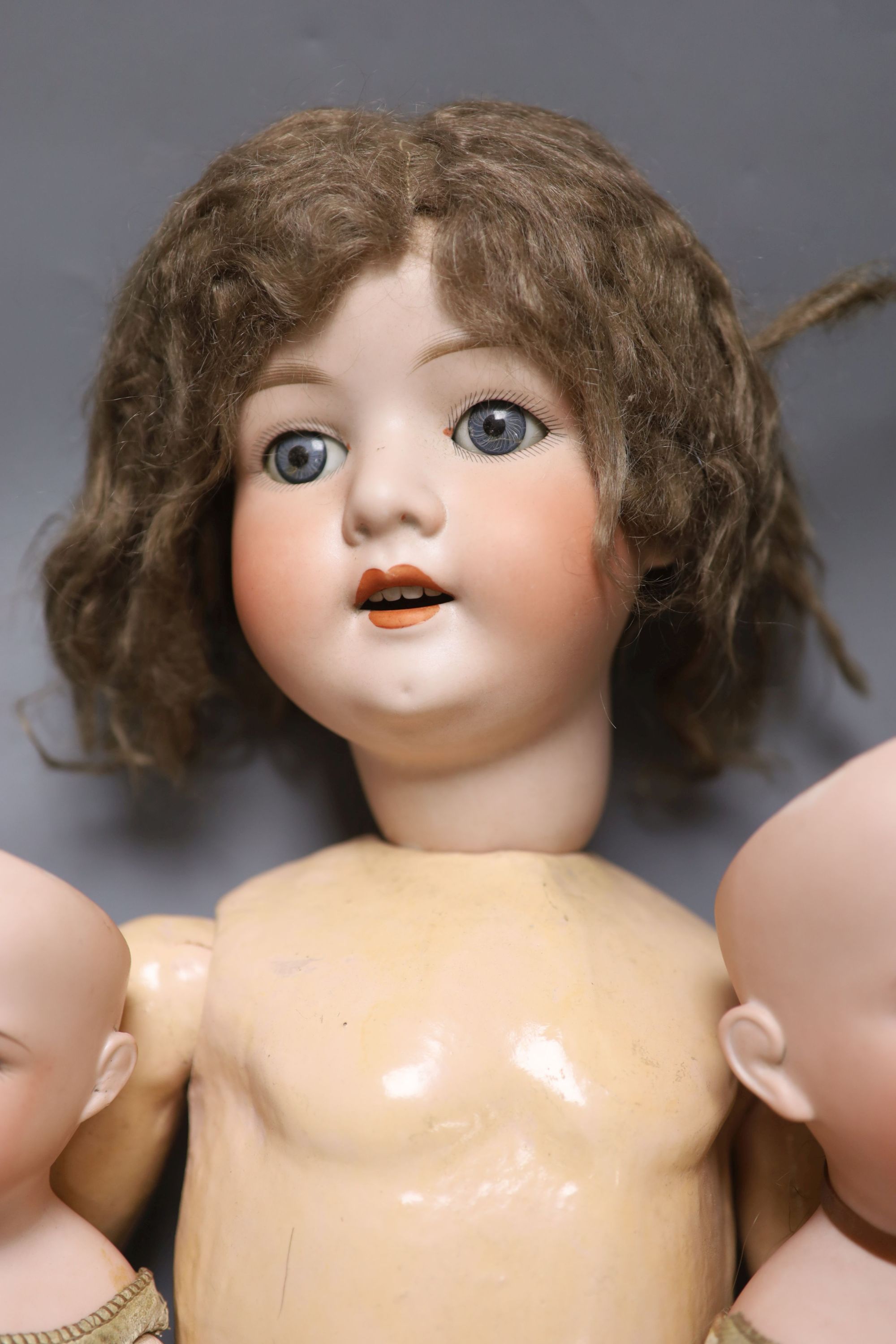 Two Armand Marseille bisque head dolls, 370 AM 4 DEP and 370 AM 2/0 DEP, with jointed kid bodies and a Koppelsdorf bisque head doll, ta